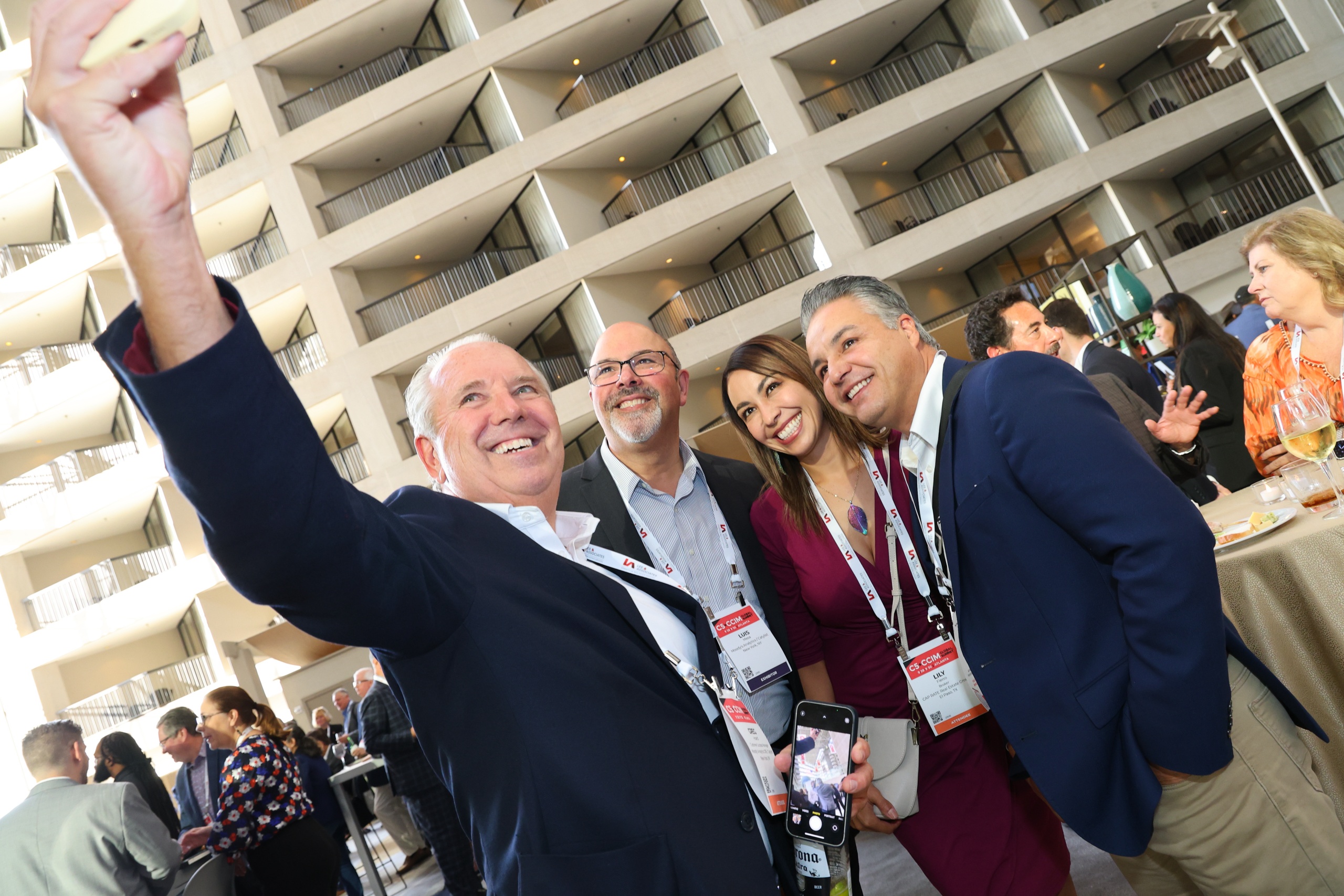 Attendees taking a selfie at the 2023 C5 + CCIM Global Summit